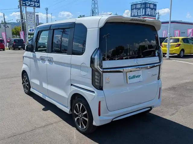 ホンダ Ｎ ＢＯＸ カスタム G L ホンダセンシング 福井県 2020(令2)年 2.5万km プラチナホワイトパール 社外7インチSDナビ【CN-RE06D】/FM AM/SD/iPod/USB/Bluetooth /CD DVD/フルセグテレビ/革巻きステアリング/ステアリングリモコン/LEDヘッドライト/オートライト/純正ビルトインETC/シートヒーター(D/N席)/ウィンカーミラー/ドアバイザー/フロアマット/プラズマクラスター装備エアコン/ホンダセンシング/レーダークルーズコントロール/レーンキープアシスト/車線はみ出し警報/横滑り防止装置/衝突被害軽減機能/標識認識機能