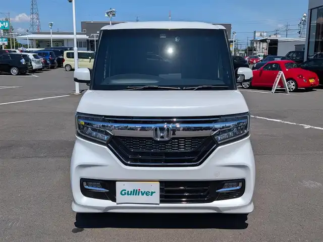 ホンダ Ｎ ＢＯＸ カスタム G L ホンダセンシング 福井県 2020(令2)年 2.5万km プラチナホワイトパール 社外7インチSDナビ【CN-RE06D】/FM AM/SD/iPod/USB/Bluetooth /CD DVD/フルセグテレビ/革巻きステアリング/ステアリングリモコン/LEDヘッドライト/オートライト/純正ビルトインETC/シートヒーター(D/N席)/ウィンカーミラー/ドアバイザー/フロアマット/プラズマクラスター装備エアコン/ホンダセンシング/レーダークルーズコントロール/レーンキープアシスト/車線はみ出し警報/横滑り防止装置/衝突被害軽減機能/標識認識機能