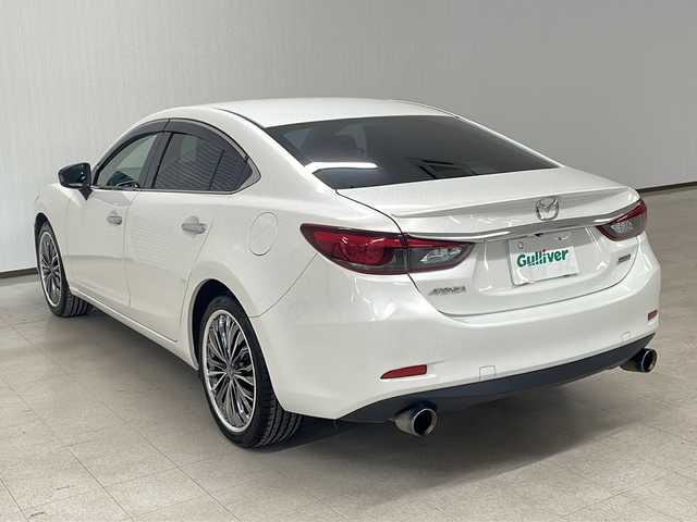 マツダ アテンザ セダン XD 熊本県 2015(平27)年 11.5万km スノーフレイクホワイトパールマイカ ・純正ナビ/BT/TV/CD/DVD/FM/AM/・バックカメラ/・クルーズコントロール/・電動パーキングブレーキ/・パドルシフト/・GReddyマフラー/・社外アルミ１９インチ/・横滑り防止装置/・ドアバイザー/・ウィンカーミラー/・ETC