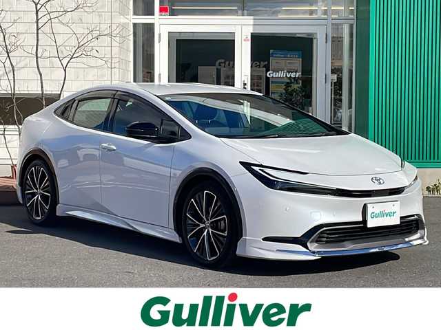 トヨタ プリウス Z 青森県 2025(令7)年 1.1万km プラチナホワイトパールマイカ OP寒冷地仕様/12.3型純正DAナビ・フルセグTV/Bluetooth・USB・HDMI/TVキャンセラー/パノラミックビューモニター/OP DA連動前後ドライブレコーダー/ETC2.0/OPデジタルインナーミラー/合皮スポーツシート/運転席メパワーシート/前席エアシート・シートヒーター/ステアリングヒーター/セーフティセンス/プリクラッシュセーフティ/レーンディパーチャーアラート/オートマチックハイビーム/レーダークルーズコントロール/ブラインドスポットモニター/アドバンスドパーク/パワーバックドア/置くだけ充電/AC100V1500W/LEDヘッドライト/リアフォグランプ/純正19インチアルミ/モデリスタエアロ