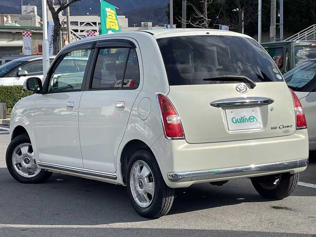 ダイハツ ミラ ジーノ X 長野県 2005(平17)年 5.5万km ホワイトパールマイカ 禁煙車/純正オーディオ（CD/MD/FM/AM）/電動格納ミラー/リモコンキー/純正フロアマット/純正ドアバイザー/社外13インチAW