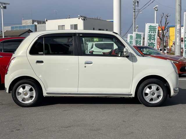 ダイハツ ミラ ジーノ X 長野県 2005(平17)年 5.5万km ホワイトパールマイカ 禁煙車/純正オーディオ（CD/MD/FM/AM）/電動格納ミラー/リモコンキー/純正フロアマット/純正ドアバイザー/社外13インチAW