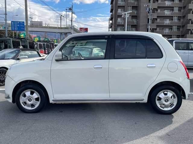 ダイハツ ミラ ジーノ X 長野県 2005(平17)年 5.5万km ホワイトパールマイカ 禁煙車/純正オーディオ（CD/MD/FM/AM）/電動格納ミラー/リモコンキー/純正フロアマット/純正ドアバイザー/社外13インチAW