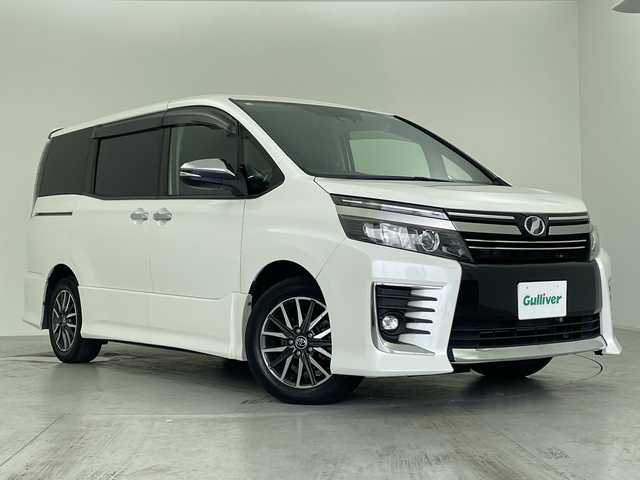 トヨタ ヴォクシー ZS 煌Ⅱ 愛知県 2016(平28)年 6.5万km ホワイトパールクリスタルシャイン 純正9インチSDナビ/・フルセグ/・Bluetooth/・CD/・DVD/純正12.1インチ後席モニター/ETC2.0/ドライブレコーダー/両側パワースライドドア/先行車発信告知機能/LDA/衝突軽減ブレーキ/横滑り防止装置/オートライト/オートハイビーム/純正16インチアルミホイール/フォグランプ/エンジンスタートボタン/スマートキー/スペアキー/保証書/取扱説明書