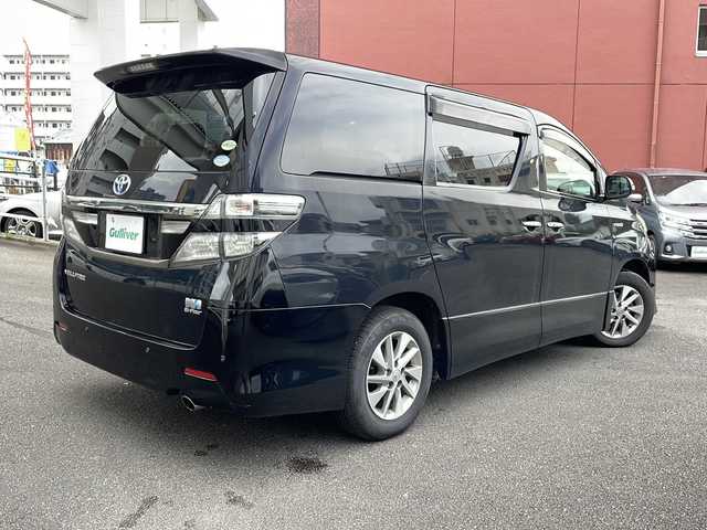 トヨタ ヴェルファイア ハイブリット ZR Gエディション 宮崎県 2012(平24)年 12.8万km ブラック 純正ナビ、Ｂｌｕｅｔｏｏｔｈ、ＣＤ・ＤＶＤ再生、ツインムーンルーフ、運転席助手席パワーシート、運転席助手席シートヒーター、運転席シートメモリー、２列目キャプテンシート、２列目オットマン、ＡＣ１００Ｖ、ETC、パワーバックドア、イージークローザー、両側パワースライドドア