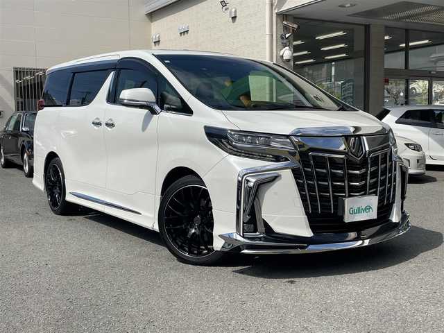 トヨタ アルファード エグゼクティブ ラウンジ S 和歌山県 2018(平30)年 7.3万km ホワイトパールクリスタルシャイン モデリスタフルエアロ/JBLサウンド/純正ナビ（AM/FM.ワンセグフルセグTV.BLUETOOTH.USB.AUX)/後席フリップダウンモニター/D/N席パワーシート/シートメモリ/助手席パワーオットマン/後席電動リクライニングシート/クルーズコントロール/サンルーフ/デジタルインナーミラー/両側パワースライドドア/電動リアゲート/前後ドライブレコーダー/全周囲カメラ/ETC2.0/フォグランプ/BSM/スペアタイヤ/車内ライト/読書灯/置くだけ充電器/リアクロストラフィックアラート/ロードサインアシスト/スマートキー/スペアキー