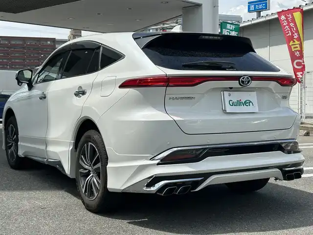 トヨタ ハリアー ハイブリッド G 福岡県 2021(令3)年 5.3万km ホワイトパールクリスタルシャイン ワンオーナー/純正メーカーナビ（フルセグTV・AM・FM・Bluetooth）/モデリスタエアロ(フロント/サイド/リア)/JBLスピーカー/電動リアゲート/ビルトインETC/レーダークルーズコントロール/コーナーセンサー（前後）/バックカメラ/ドライブセレクトモード/ドライブレコーダー（前後）/USB入力端子/ウィンカーミラー/純正18インチホイール/純正フロアマット/LEDヘッドライト/LEDフォグランプ/オートライト/オートハイビーム/ドアバイザー/プッシュスタートボタン/AACエアコン/スマートキー×２本/取扱説明書/保証書
