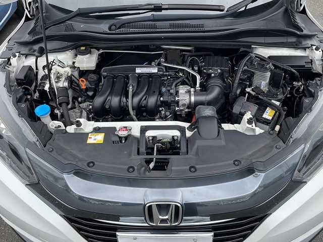 ホンダ ヴェゼル ハイブリッド X 岩手県 2015(平27)年 9.3万km ホワイトオーキッドパール 社外ナビ/ワンセグTV/バックカメラ/ETC/クルーズコントロール/衝突被害軽減ブレーキ/シートヒーター/オートライト/LEDヘッドライト/フォグランプ/スマートキー/プッシュスタート/電動格納ミラー/純正16インチAW/純正フロアマット/保証書/取扱説明書