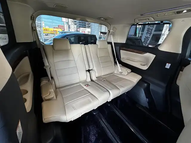 トヨタ ヴェルファイア ハイブリット エグゼクティブ ラウンジ 大分県 2015(平27)年 3.8万km ホワイトパールクリスタルシャイン ワンオーナー/JBLプレミアムサウンド/純正SDナビ/Bluetooth/フルセグ/CD/DVD/モデリスタフルエアロ/Pantneraセキュリティ/全方位カメラ/レーダークルーズコントロール/パワーシート/オットマン/シートメモリー/フリップダウンモニター/100VAC/置くだけ充電（Qi）/社外GPSレーダー/コーナーセンサー/両側パワースライドドア/パワーバックドア/USB・HDMI入力端子/純正アルミホイル17インチ/純正フロアマット/ステアリングスイッチ/ステアリングヒーター/3列シート/オートライト/オートハイビーム/ETC/ドライブレコーダー/チップアップシート/ウッドコンビハンドル/nanoe/スタットレスタイヤ/スペアキー