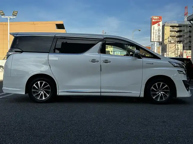 トヨタ ヴェルファイア ハイブリット エグゼクティブ ラウンジ 大分県 2015(平27)年 3.8万km ホワイトパールクリスタルシャイン ワンオーナー/JBLプレミアムサウンド/純正SDナビ/Bluetooth/フルセグ/CD/DVD/モデリスタフルエアロ/Pantneraセキュリティ/全方位カメラ/レーダークルーズコントロール/パワーシート/オットマン/シートメモリー/フリップダウンモニター/100VAC/置くだけ充電（Qi）/社外GPSレーダー/コーナーセンサー/両側パワースライドドア/パワーバックドア/USB・HDMI入力端子/純正アルミホイル17インチ/純正フロアマット/ステアリングスイッチ/ステアリングヒーター/3列シート/オートライト/オートハイビーム/ETC/ドライブレコーダー/チップアップシート/ウッドコンビハンドル/nanoe/スタットレスタイヤ/スペアキー