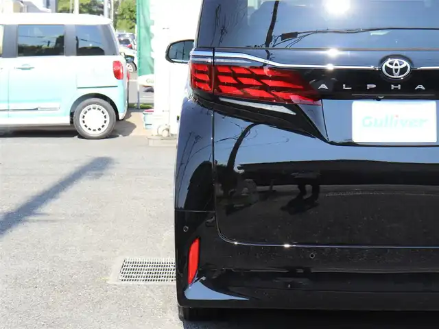トヨタ アルファードハイブリット Z 神奈川県 2025(令7)年 0.1千km ブラック ワンオーナー/TOYOTAチームメイト/ムーンルーフ/ユニバーサルステップ/パーキングサポートブレーキ(後方歩行者)/床下透過表示機能付パラノミックビューモニター/バックカメラ洗浄機能/自動防眩インナーミラー/ステアリングヒーター/排気ガス検知式フルオートエアコン/マイコンプリセットドライビングポジションシステム/助手席肩口パワーシートスイッチ/2列目エグゼクティブシート/14インチディスプレイオーディオ/10スピーカー/JBLサウンドスピーカー/アドバンストパーク/パーキングサポートシステム/アドバントドライブ/フロントクロストラフィックアラート/レーンチェンジアシスト/ドライバーモニターカメラ/パドルシフト/エレクトロシフトマチック/保証書/スペアスマートキー/純正メモリナビ/フルセグテレビ/アラウンドビューモニター/ウィンカーミラー/オットマン/アダクティブアクティブクルーズコントロール/ドアバイザー/プッシュスタート/両側パワースライドドア/パワーバックドア/ETC2.0/デジタルインナーミラー/置くだけ充電/100V電源