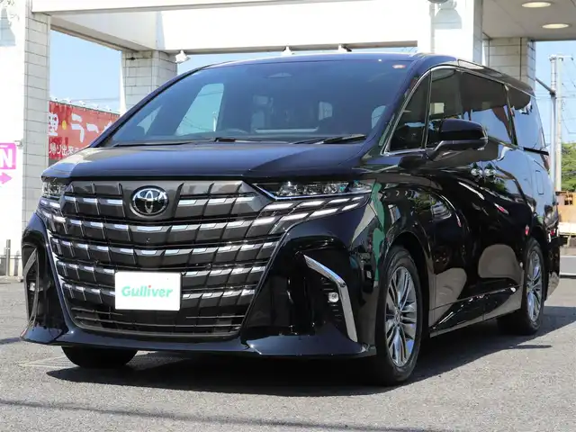 トヨタ アルファードハイブリット Z 神奈川県 2025(令7)年 0.1千km ブラック ワンオーナー/TOYOTAチームメイト/ムーンルーフ/ユニバーサルステップ/パーキングサポートブレーキ(後方歩行者)/床下透過表示機能付パラノミックビューモニター/バックカメラ洗浄機能/自動防眩インナーミラー/ステアリングヒーター/排気ガス検知式フルオートエアコン/マイコンプリセットドライビングポジションシステム/助手席肩口パワーシートスイッチ/2列目エグゼクティブシート/14インチディスプレイオーディオ/10スピーカー/JBLサウンドスピーカー/アドバンストパーク/パーキングサポートシステム/アドバントドライブ/フロントクロストラフィックアラート/レーンチェンジアシスト/ドライバーモニターカメラ/パドルシフト/エレクトロシフトマチック/保証書/スペアスマートキー/純正メモリナビ/フルセグテレビ/アラウンドビューモニター/ウィンカーミラー/オットマン/アダクティブアクティブクルーズコントロール/ドアバイザー/プッシュスタート/両側パワースライドドア/パワーバックドア/ETC2.0/デジタルインナーミラー/置くだけ充電/100V電源