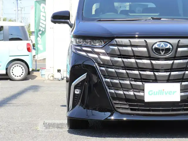 トヨタ アルファードハイブリット Z 神奈川県 2025(令7)年 0.1千km ブラック ワンオーナー/TOYOTAチームメイト/ムーンルーフ/ユニバーサルステップ/パーキングサポートブレーキ(後方歩行者)/床下透過表示機能付パラノミックビューモニター/バックカメラ洗浄機能/自動防眩インナーミラー/ステアリングヒーター/排気ガス検知式フルオートエアコン/マイコンプリセットドライビングポジションシステム/助手席肩口パワーシートスイッチ/2列目エグゼクティブシート/14インチディスプレイオーディオ/10スピーカー/JBLサウンドスピーカー/アドバンストパーク/パーキングサポートシステム/アドバントドライブ/フロントクロストラフィックアラート/レーンチェンジアシスト/ドライバーモニターカメラ/パドルシフト/エレクトロシフトマチック/保証書/スペアスマートキー/純正メモリナビ/フルセグテレビ/アラウンドビューモニター/ウィンカーミラー/オットマン/アダクティブアクティブクルーズコントロール/ドアバイザー/プッシュスタート/両側パワースライドドア/パワーバックドア/ETC2.0/デジタルインナーミラー/置くだけ充電/100V電源
