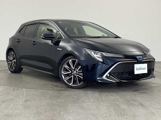 トヨタ カローラ スポーツ ハイブリッドG Z 兵庫県 2018(平30)年 6.1万km ブラッキッシュアゲハガラスフレーク ・純正9インチナビ（フルセグ・DVD・CD・USB・BT）/・レーダークルーズコントロール/・プリクラッシュセーフティ/・レーンキープアシスト/・レーンディパチャ―アラート/・オートマチックハイビーム/・先行車発進通知/・クリアナンスソナー/・BSM/・HUD/・前後誤発進抑制機能/・標識認識機能/・バックカメラ/・社外フロントカメラ/・純正ドライブレコーダー（前方＋室内）/・ビルトインETC/・純正18インチアルミホイール/・LEDオートライト/・社外レーダー探知機/・純正フロアマット/・W＋サイドエアバック/・カーテンエアバック/・スマートキー/・プッシュスタート
