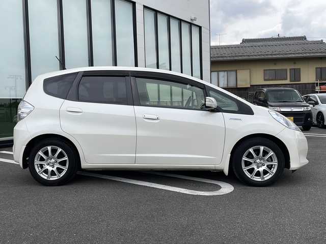 ホンダ フィット ハイブリット スマート セレクション 岐阜県 2012(平24)年 11.6万km パール 社外ナビ　/ワンセグTV　/ETC　/バックカメラ　/前後ドライブレコーダー　/クルーズコントロール　/純正フロアマット　/ドアバイザー　/HIDライト　/オートライト　/衝突軽減ブレーキ