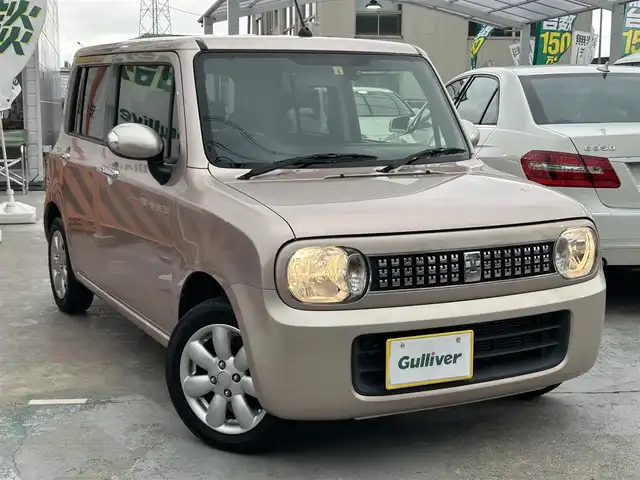 スズキ ラパン XL 京都府 2014(平26)年 4万km シャンパンピンクPM  社外SDナビ/　・フルセグTV/　・BTオーディオ/　・CD/DVD再生/　・AM/FM/　・バックカメラ/ D席シートヒーター/ 社外ドライブレコーダー/ ETC/ 12Vシガーソケット/ フロアマット/ 電動格納ミラー/ レベライザー/ アイドリングストップ/ 純正14インチアルミホイール