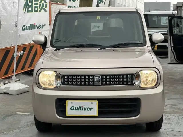 スズキ ラパン XL 京都府 2014(平26)年 4万km シャンパンピンクPM  社外SDナビ/　・フルセグTV/　・BTオーディオ/　・CD/DVD再生/　・AM/FM/　・バックカメラ/ D席シートヒーター/ 社外ドライブレコーダー/ ETC/ 12Vシガーソケット/ フロアマット/ 電動格納ミラー/ レベライザー/ アイドリングストップ/ 純正14インチアルミホイール