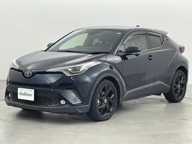 トヨタ Ｃ－ＨＲ G モード ネロ 福岡県 2019(平31)年 0.9万km ブラッキッシュアゲハガラスフレーク 純正ナビ（ＢＴ，フルセグＴＶ）　/バックカメラ　/ビルトインＥＴＣ　/前方ドラレコ　/ＡＣＣ　/コーナーセンサー　/衝突軽減ブレーキ　/レーンキープ　/ＢＳＭ/ハーフレザー　/前席シートヒーター　/純正１８インチＡＷ