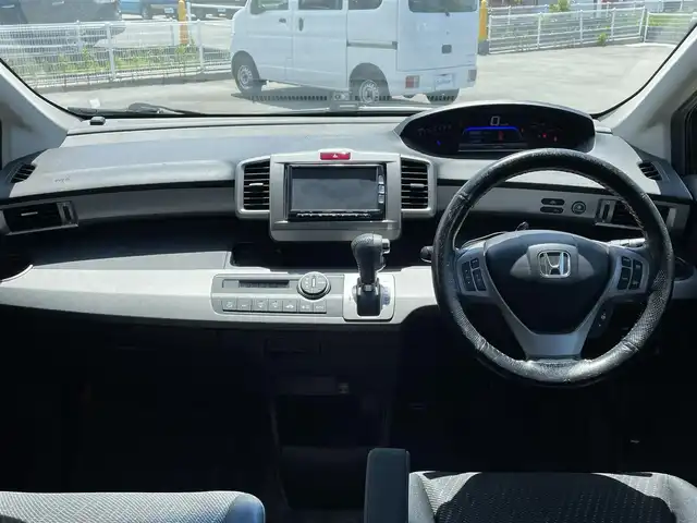 ホンダ フリード ハイブリット ジャストセレクション 富山県 2012(平24)年 12.5万km プレミアムブラキッシュパール 1オーナー/10.1型アルパインフリップダウンモニター/純正ナビ（CD DVD bluetooth MSV（SD））/フルセグTV/バックカメラ/ETC/スマートキー/左パワースライドドア/フォグ/クルーズコントロール/純正マット/社外バイザー/保証書、取説/スペアキー
