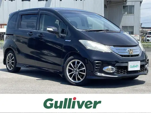 ホンダ フリード ハイブリット ジャストセレクション 富山県 2012(平24)年 12.5万km プレミアムブラキッシュパール 1オーナー/10.1型アルパインフリップダウンモニター/純正ナビ（CD DVD bluetooth MSV（SD））/フルセグTV/バックカメラ/ETC/スマートキー/左パワースライドドア/フォグ/クルーズコントロール/純正マット/社外バイザー/保証書、取説/スペアキー
