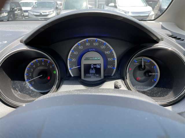 ホンダ フィット シャトル ハイブリッド スマートセレ 滋賀県 2013(平25)年 6.9万km グリーンオパールメタリック 禁煙車/純正ナビ/【CD/DVD/ワンセグTV】/バックカメラ/ビルトインＥＴＣ/スマートキー/コンフォートビューパッケージ/クルーズコントロール/ステアリングスイッチ/ハーフレザーシート/ＨＩＤヘッドライト/オートライト/オートエアコン