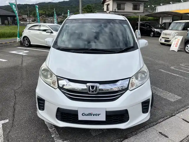 ホンダ フリード G ジャストセレクション 広島県 2015(平27)年 5.6万km ホワイトオーキッドパール 純正ディーラーナビ（VXM-152VFi）/バックカメラ/フルセグTV/Bluetooth/パワースライドドア（助手席側）/HIDヘッドライト/オートライト/ビルトインETC/プラズマクラスター/オートエアコン/社外14インチアルミホイール/スマートキーシステム/取扱説明書/スペアキー