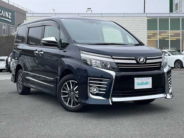 トヨタ ヴォクシー ZS 煌Ⅱ 山梨県 2016(平28)年 4.7万km スパークリングブラックパールクリスタルシャイン 純正SDナビ【NSZT-ZA4T】/ＣＤ/ＤＶＤ/ＢＴ/フルセグテレビ/バックカメラ/衝突軽減ブレーキ/レーンキープアシスト/オートハイビーム/アイドリングストップ/プッシュスタート/両側パワースライドドア/ETC/純正LEDヘッドライト/純正アルミホイール/モデリスタエアロ（サイド・リアアンダー）