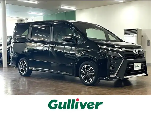 トヨタ ヴォクシー ZS 煌Ⅱ 道央・札幌 2019(令1)年 9.5万km イナズマスパーキングブラックガラスフレーク ワンオーナー/4WD/寒冷地仕様/純正10.5型ナビ/フルセグTV/CD/DVD/Bluetooth/SD/バックカメラ/純正フリップダウンモニター/両側パワスラ/ビルトインETC/衝突軽減ブレーキ/レーンキープアシスト/横滑り防止/オートマチックハイビーム/前後ドラレコ/純正エンジンスターター/クルーズコントロール/社外レーダー/プッシュスタート/スマートキー/純正16インチAW/保証書/取扱説明書