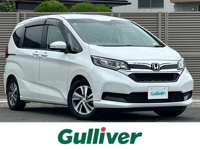 ホンダ フリード G ホンダセンシング 千葉県 2021(令3)年 1.4万km プラチナホワイトパール 純正メモリナビ/フルセグテレビ/バックカメラ/純正前後ドライブレコーダー/ETC/Bluetooth接続/CD/DVD/SD再生/両側パワースライドドア/アダプティブクルーズコントロール/運転席・助手席シートヒーター/アイドリングストップ/ホンダセンシング/路外逸脱抑制システム/レーンキープアシスト/標識認識機能/衝突被害軽減システム/フロントガラス熱線スイッチ/電動格納ウィンカーミラー/オートライト/LEDヘッドライト/純正フロアマット/純正15インチアルミホイール/取扱説明書/保証書