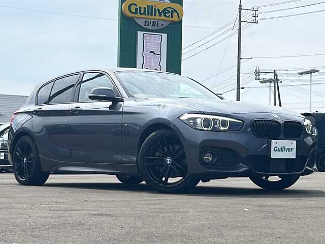 ＢＭＷ １１８ｄ Mスポーツ エディションシャドー 山口県 2017(平29)年 6.5万km ミネラルグレー 純正ナビゲーション/バックカメラ/コンフォートパッケージ/アクティブクルーズコントロール/パーキングサポートパッケージ/LEDヘッドランプ/オートライト/左右独立温度調整オートエアコン/ミラー一体型ETC/ダコタ革シート/シートヒーター【運転席/助手席】/保証書/取扱説明書/スペアキー１本