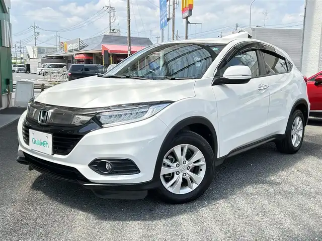 ホンダ ヴェゼル X ホンダセンシング 福岡県 2019(令1)年 5.3万km プラチナホワイトパール ・ディーラー点検記録簿R2~R6年有り/・純正ナビ（DVD/CD/TV/SD/USB/BT）/・フルセグテレビ/・バックカメラ/・ステアリングスイッチ/・クルーズコントロール/・アイドリングストップ/・電子パーキング/・ブレーキホールド/・横滑り防止装置/・衝突被害軽減システム/・レーンアシスト/・先行車発進お知らせ/・ドライブレコーダー（前後）/・ECOモード/・ETC/・オートライト/・LEDヘッドライト/・フォグライト/・プッシュスタート/・スマートキー/・スペアキー×１/・電動格納ミラー/・ウィンカーミラー/・純正フロアマット/・純正１６インチアルミホイール/・保証書/・取説