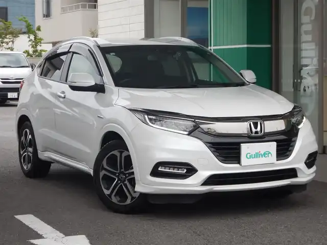 ホンダ ヴェゼル ハイブリッド Z ホンダセンシング 静岡県 2020(令2)年 7.1万km プラチナホワイトパール ワンオーナー/衝突軽減ブレーキ/車線逸脱警報/ルーフレール/純正メモリナビ/・VXM-205VFEi/・フルセグ/・DVD再生/・CD再生/・Bluetooth接続/バックカメラ/LEAFTEC製ドライブレコーダー/・KDR-L30/・車内録画機能付き/アダプティブクルーズコントロール/・車線維持システム付き/ETC/ハーフレザーシート/前席シートヒーター/本革巻きステアリング/パドルシフト/ISOFIX/オートワイパー/オートライト/フォグライト/オールオートウィンドウ/ウインカーミラー/電動格納ミラー/純正フロアマット/純正フットライト/ドアバイザー/プッシュスタート/スマートキー×2/取扱説明書/新車保証書