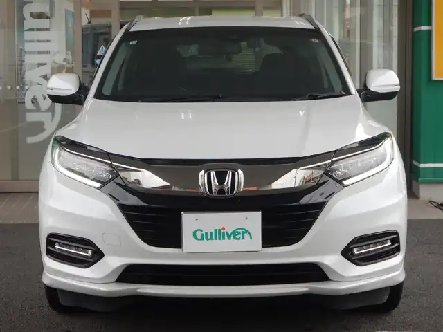 ホンダ ヴェゼル ハイブリッド Z ホンダセンシング 静岡県 2020(令2)年 7.1万km プラチナホワイトパール ワンオーナー/衝突軽減ブレーキ/車線逸脱警報/ルーフレール/純正メモリナビ/・VXM-205VFEi/・フルセグ/・DVD再生/・CD再生/・Bluetooth接続/バックカメラ/LEAFTEC製ドライブレコーダー/・KDR-L30/・車内録画機能付き/アダプティブクルーズコントロール/・車線維持システム付き/ETC/ハーフレザーシート/前席シートヒーター/本革巻きステアリング/パドルシフト/ISOFIX/オートワイパー/オートライト/フォグライト/オールオートウィンドウ/ウインカーミラー/電動格納ミラー/純正フロアマット/純正フットライト/ドアバイザー/プッシュスタート/スマートキー×2/取扱説明書/新車保証書
