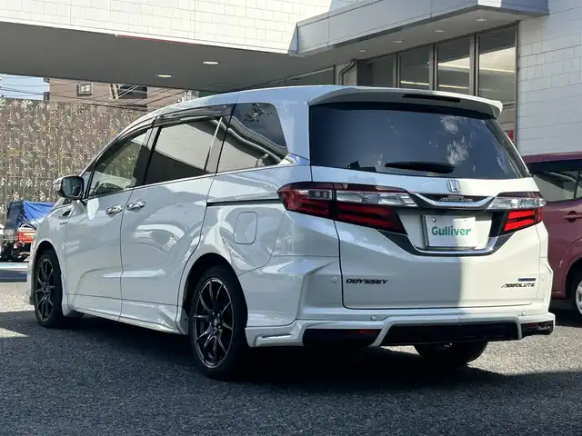 ホンダ オデッセイ ハイブリッド アブソルートセンシングEXパック 愛知県 2016(平28)年 10.5万km ホワイトオーキッドパール 純正8インチディーラーオプションナビ(FM/AM/CD/DVD/USB/BT/iPod/HDMI/フルセグ)/フリップダウンモニター/ホンダセンシング/衝突軽減ブレーキ/路外逸脱抑制機能/アダクティブクルーズコントロール/車両接近通報装置/ブラインドスポットモニター/クリアランスソナー・コーナーセンサー/バックカメラ/ハーフレザー/パワーシート/両側パワースライドドア/ドライブレコーダー/HIDヘッドライト/電動格納ミラー/社外AW18インチ/純正フロアマット/ETC/プッシュスタート/スマートキー・スペアキー１本/ABS/取扱説明書・保証書