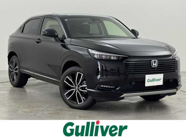ホンダ ヴェゼル ハイブリッド e:HEV Z 福岡県 2025(令7)年 0.1千km クリスタルブラックパール 登録済未使用車　/純正９型ＤＡナビ　/バックカメラ　/置くだけ充電　/アダプティブクルコン　/コーナーセンサー　/衝突軽減ブレーキ　/レーンキープ　/ＢＳＭ　/アクセル踏み間違い防止　/ヒルディセントコントロール　/ＭＴモード付き　/パワーバックドア　/ハーフレザーシート　/シートヒーター　/ＬＥＤヘッドライト