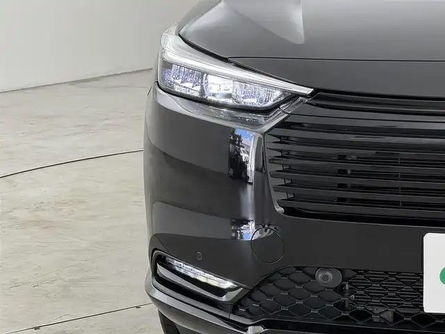 ホンダ ヴェゼル ハイブリッド e:HEV Z 福岡県 2025(令7)年 0.1千km クリスタルブラックパール 登録済未使用車　/純正９型ＤＡナビ　/バックカメラ　/置くだけ充電　/アダプティブクルコン　/コーナーセンサー　/衝突軽減ブレーキ　/レーンキープ　/ＢＳＭ　/アクセル踏み間違い防止　/ヒルディセントコントロール　/ＭＴモード付き　/パワーバックドア　/ハーフレザーシート　/シートヒーター　/ＬＥＤヘッドライト