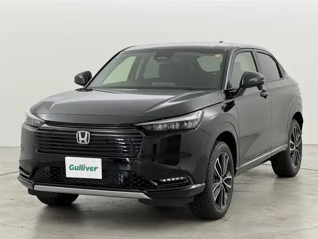 ホンダ ヴェゼル ハイブリッド e:HEV Z 福岡県 2025(令7)年 0.1千km クリスタルブラックパール 登録済未使用車　/純正９型ＤＡナビ　/バックカメラ　/置くだけ充電　/アダプティブクルコン　/コーナーセンサー　/衝突軽減ブレーキ　/レーンキープ　/ＢＳＭ　/アクセル踏み間違い防止　/ヒルディセントコントロール　/ＭＴモード付き　/パワーバックドア　/ハーフレザーシート　/シートヒーター　/ＬＥＤヘッドライト
