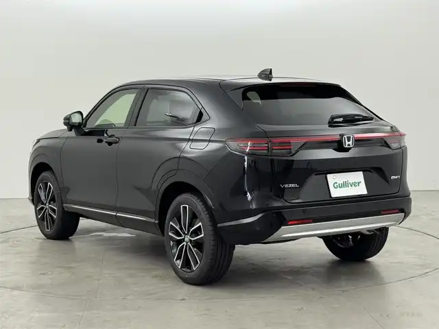 ホンダ ヴェゼル ハイブリッド e:HEV Z 福岡県 2025(令7)年 0.1千km クリスタルブラックパール 登録済未使用車　/純正９型ＤＡナビ　/バックカメラ　/置くだけ充電　/アダプティブクルコン　/コーナーセンサー　/衝突軽減ブレーキ　/レーンキープ　/ＢＳＭ　/アクセル踏み間違い防止　/ヒルディセントコントロール　/ＭＴモード付き　/パワーバックドア　/ハーフレザーシート　/シートヒーター　/ＬＥＤヘッドライト