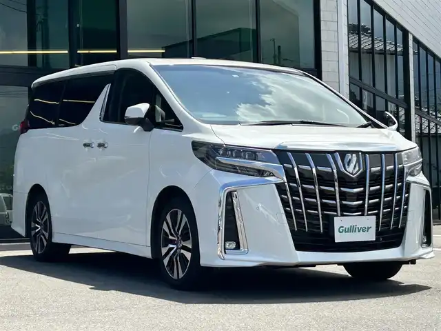 トヨタ アルファード S Cパッケージ 愛媛県 2022(令4)年 3.5万km ホワイトパールクリスタルシャイン 純正ディスプレイオーディオ（Bluetooth/SD/フルセグテレビ）/DVDデッキ/純正フリップダウンモニター/ETC/サンルーフ/バックカメラ/前後ドライブレコーダー/両側電動スライドドア/シートヒーター/エアシート/ステアリングヒーター/オットマン/電動リアゲート/パワーシート/シートメモリー/純正フロアマット/純正18インチアルミホイール/追従型クルーズコントロール/ABS/横滑り防止装置/前後コーナーセンサー/レーンキープアシスト/盗難防止装置/衝突被害軽減システム/オートライト/オートマチックハイビーム/LEDヘッドライト