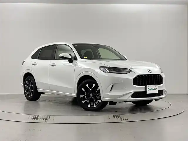 ホンダ ＺＲ－Ｖ ハイブリッド e:HEV Z 埼玉県 2024(令6)年 0.4万km プラチナホワイトパール 純正ナビ/(Bluetooth/USB/AM/FM)/地デジフルセグ/バックカメラ/アラウンドビューモニター/ETC2.0/Honda SENSING/・衝突軽減ブレーキ/・先行車発進お知らせ機能/・路外逸脱抑制機能/・標識認識機能/・渋滞追従機能付アダプティブクルーズコントロール/・車線維持支援システム/・ブラインドスポットインフォメーション/・オートハイビーム/BOSEプレミアムサウンドシステム/ハンズフリーアクセスパワーテールゲート/パドルシフト/前席シートヒーター/置くだけ充電/ダウンヒルアシストコントロール/ドライブモードセレクト/電子パーキングシステム/ブレーキホールド/パワーバックドア/純正フロアマット/純正18インチアルミホイール