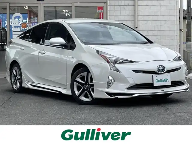 トヨタ プリウス A ツーリングセレクション 岩手県 2016(平28)年 6.7万km ホワイトパールクリスタルシャイン 4WD/モデリスタエアロ(フロント、バック、サイド)/9インチ純正ナビ(AM/FM/BT/CD)/フルセグTV/バックカメラ/レーダークルーズコントロール/レーンキープアシスト/衝突軽減ブレーキ/ヘッドアップディスプレイ/ブラインドスポットモニター/横滑り防止装置/前後コーナーセンサー/ビルトインETC/レザーシート/オートマチックハイビーム/オートライト/LEDヘッドライト/純正AW/純正フロアマット