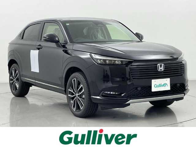 ホンダ ヴェゼル ハイブリッド e:HEV Z 熊本県 2025(令7)年 0.1千km クリスタルブラックパール 登録済未使用車/純正ナビ（ＡｐｐｌＣａｒＰｌａｙ・ＡｎｄｒｏｉｄＡｕｔｏ・ＢＴ）/バックカメラ　/ビルトインＥＴＣ2.0/ホンダセンシング/・レーダークルーズコントロール　/・衝突軽減ブレーキ/・誤発進制御機能/・路外逸脱制御機能/・車線維持支援システム/・先行車発進お知らせ機能/・標識認識機能/・オートハイビーム/・ブラインドスポットモニター/横滑り防止/前席シートヒーター　/ステアリングヒーター　/パワーバックドア/置くだけ充電/純正１８インチAW/オートライト/オートマチックハイビーム/フォグライト/スマートキー/スペアキー1本/保証書/取扱説明書
