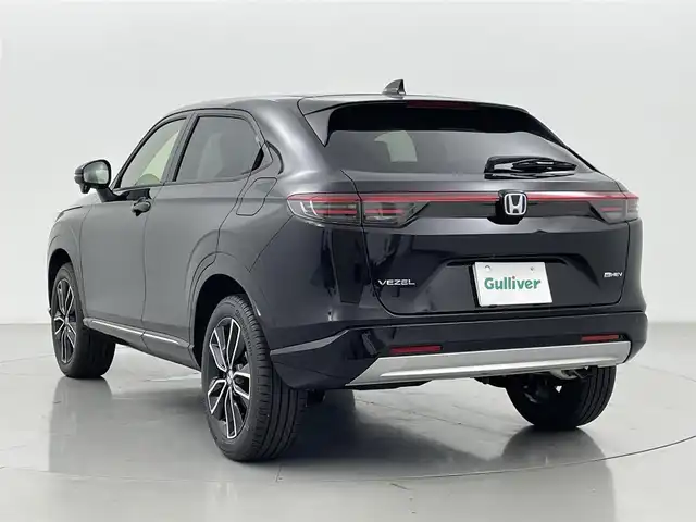 ホンダ ヴェゼル ハイブリッド e:HEV Z 熊本県 2025(令7)年 0.1千km クリスタルブラックパール 登録済未使用車/純正ナビ（ＡｐｐｌＣａｒＰｌａｙ・ＡｎｄｒｏｉｄＡｕｔｏ・ＢＴ）/バックカメラ　/ビルトインＥＴＣ2.0/ホンダセンシング/・レーダークルーズコントロール　/・衝突軽減ブレーキ/・誤発進制御機能/・路外逸脱制御機能/・車線維持支援システム/・先行車発進お知らせ機能/・標識認識機能/・オートハイビーム/・ブラインドスポットモニター/横滑り防止/前席シートヒーター　/ステアリングヒーター　/パワーバックドア/置くだけ充電/純正１８インチAW/オートライト/オートマチックハイビーム/フォグライト/スマートキー/スペアキー1本/保証書/取扱説明書