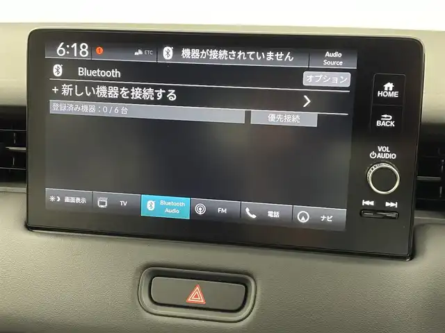 ホンダ ヴェゼル ハイブリッド e:HEV Z 熊本県 2025(令7)年 0.1千km クリスタルブラックパール 登録済未使用車/純正ナビ（ＡｐｐｌＣａｒＰｌａｙ・ＡｎｄｒｏｉｄＡｕｔｏ・ＢＴ）/バックカメラ　/ビルトインＥＴＣ2.0/ホンダセンシング/・レーダークルーズコントロール　/・衝突軽減ブレーキ/・誤発進制御機能/・路外逸脱制御機能/・車線維持支援システム/・先行車発進お知らせ機能/・標識認識機能/・オートハイビーム/・ブラインドスポットモニター/横滑り防止/前席シートヒーター　/ステアリングヒーター　/パワーバックドア/置くだけ充電/純正１８インチAW/オートライト/オートマチックハイビーム/フォグライト/スマートキー/スペアキー1本/保証書/取扱説明書