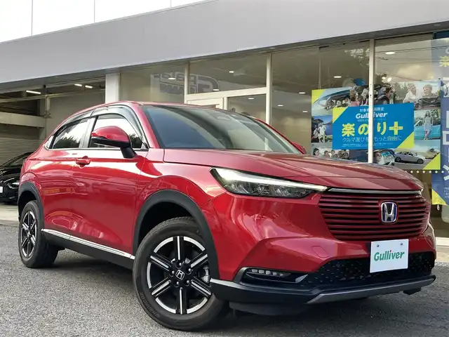 ホンダ ヴェゼル ハイブリッド e:HEV X 長崎県 2022(令4)年 2.1万km プレミアムクリスタルレッドM ホンダセンシング/・衝突被害軽減ブレーキ/・レーダークルーズコントロール/・レーンキープアシスト/Honda CONNECTディスプレー/・ナビ/・Bluetooth接続/・フルセグTV/・スマートフォン連携/バックカメラ/ビルトインETC2.0/ワイヤレス充電/ステアリングスイッチ/パドルシフト/電子パーキング/オートホールド機能/ダウンヒルアシスト/コーナーセンサー/横すべり防止装置/ISOFIX/ドライブレコーダー