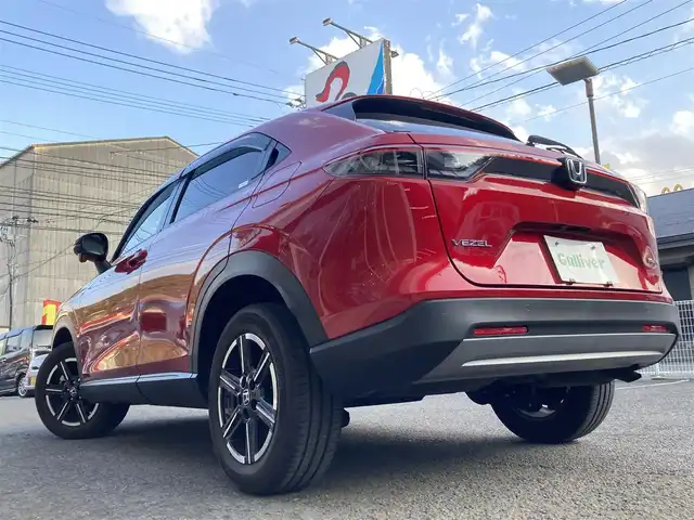 ホンダ ヴェゼル ハイブリッド e:HEV X 長崎県 2022(令4)年 2.1万km プレミアムクリスタルレッドM ホンダセンシング/・衝突被害軽減ブレーキ/・レーダークルーズコントロール/・レーンキープアシスト/Honda CONNECTディスプレー/・ナビ/・Bluetooth接続/・フルセグTV/・スマートフォン連携/バックカメラ/ビルトインETC2.0/ワイヤレス充電/ステアリングスイッチ/パドルシフト/電子パーキング/オートホールド機能/ダウンヒルアシスト/コーナーセンサー/横すべり防止装置/ISOFIX/ドライブレコーダー