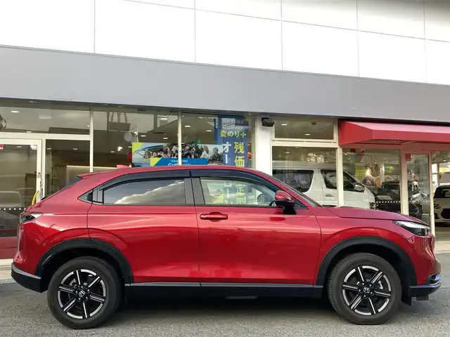 ホンダ ヴェゼル ハイブリッド e:HEV X 長崎県 2022(令4)年 2.1万km プレミアムクリスタルレッドM ホンダセンシング/・衝突被害軽減ブレーキ/・レーダークルーズコントロール/・レーンキープアシスト/Honda CONNECTディスプレー/・ナビ/・Bluetooth接続/・フルセグTV/・スマートフォン連携/バックカメラ/ビルトインETC2.0/ワイヤレス充電/ステアリングスイッチ/パドルシフト/電子パーキング/オートホールド機能/ダウンヒルアシスト/コーナーセンサー/横すべり防止装置/ISOFIX/ドライブレコーダー
