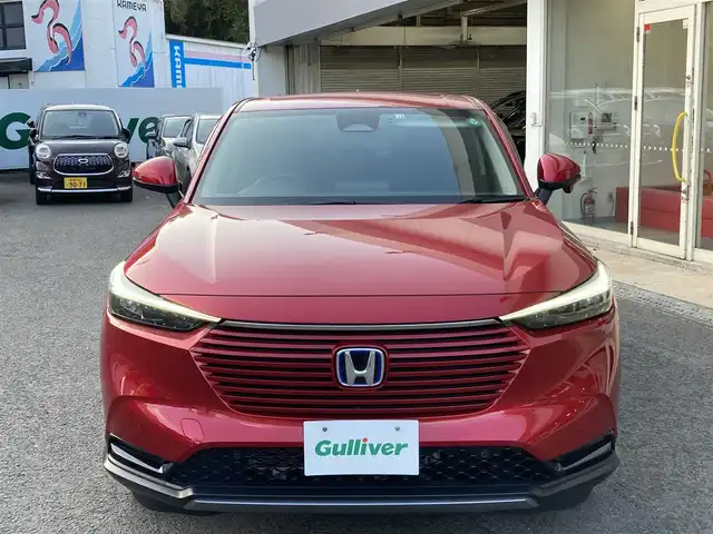 ホンダ ヴェゼル ハイブリッド e:HEV X 長崎県 2022(令4)年 2.1万km プレミアムクリスタルレッドM ホンダセンシング/・衝突被害軽減ブレーキ/・レーダークルーズコントロール/・レーンキープアシスト/Honda CONNECTディスプレー/・ナビ/・Bluetooth接続/・フルセグTV/・スマートフォン連携/バックカメラ/ビルトインETC2.0/ワイヤレス充電/ステアリングスイッチ/パドルシフト/電子パーキング/オートホールド機能/ダウンヒルアシスト/コーナーセンサー/横すべり防止装置/ISOFIX/ドライブレコーダー