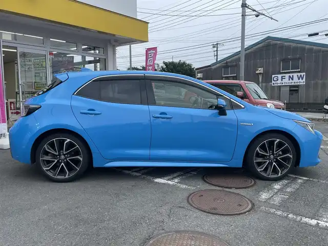 トヨタ カローラ スポーツ ハイブリッドG Z 神奈川県 2019(令1)年 12.8万km シアンM ワンオーナー/トヨタセーフティセンス/・衝突軽減ブレーキ/・レーダークルーズコントロール/・ブラインドスポットモニター/・コーナーセンサー/ヘッドアップディスプレイ/ステアリングスイッチ/バックカメラ/ビルトインETC2.0/プッシュスタート/スマートキーx2/LEDヘッドライト/フォグライト/純正18インチアルミホイール/4:2:4分割アジャスタブルデッキボード/保証書/ナビ取説/取説
