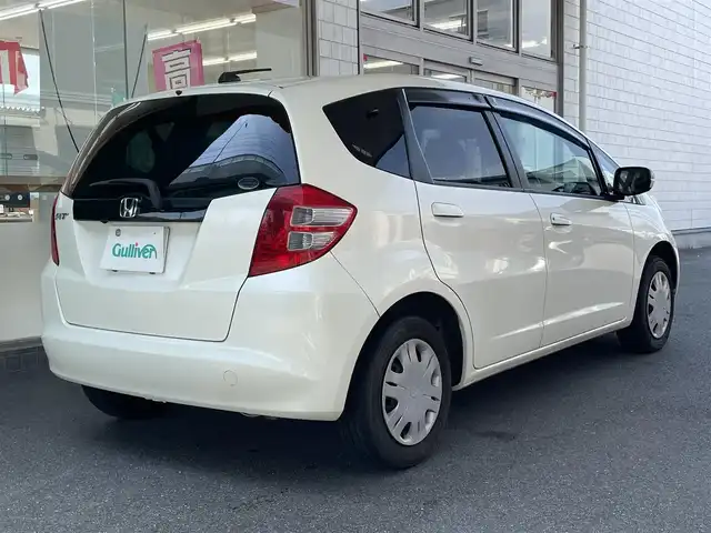 ホンダ フィット L ハイウェイ エディション 愛知県 2009(平21)年 9.1万km プレミアムホワイトパール ワンオーナー/純正HDDインターナビ〈MOP〉/・ワンセグTV/CD/DVD/バックカメラ/ビルトインETC/オートエアコン/オートライト機能付HIDヘッドライト/運転席アームレスト＆シートリフター/前方ドライブレコーダー（ZDR-012）